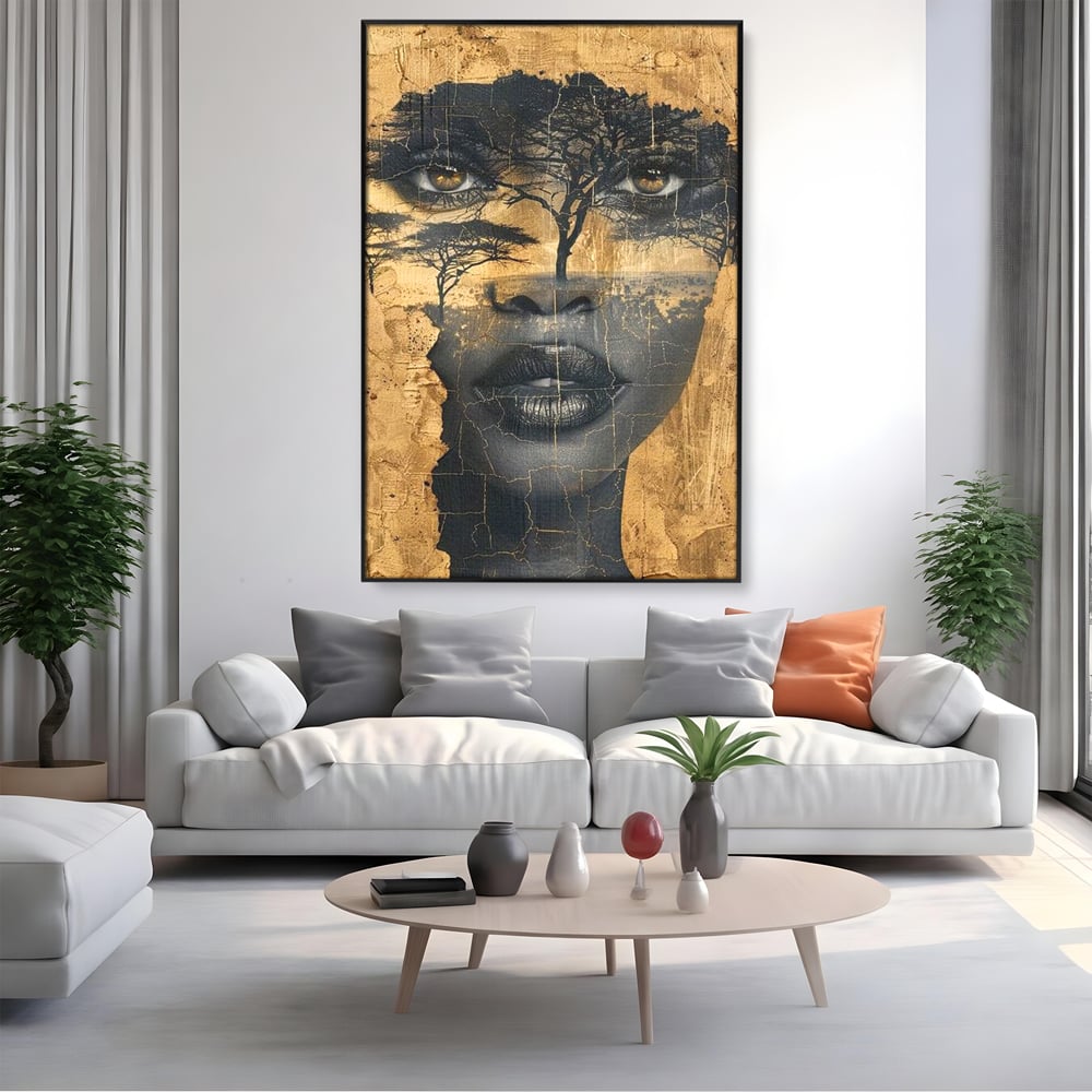 Tablou canvas cu tablou canvas cu chip de femeie si copaci, in rama de aluminiu negru, pe perete intr-un living